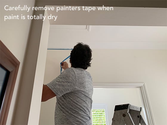 painters tape protects the edges of the already painted walls