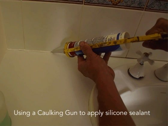 applying silicone sealant using a caulking gun